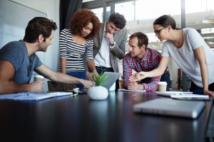 People surrounded around computer